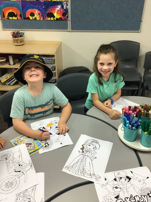 ACTIVITIES: Mason Woolner and Aria Cassilles were all smiles at Leeton Out of School Care this week. Photo: Supplied