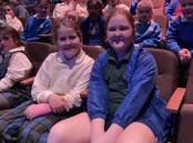 FUN: Pippa Lashbrook and Makayla Perram from Leeton Public School were excited to come to Griffith and support their classmates. PHOTO: Cai Holroyd