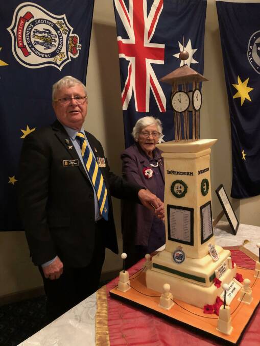 MILESTONE: Leeton's John Power and Heather Whittaker cut the cake to signify the two anniversaries. Photo: Karleen Reilly 