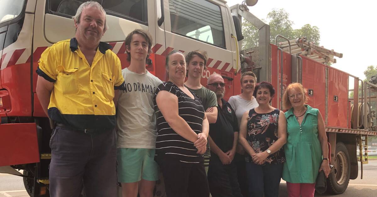 WELL DONE: The Yanco RFS Brigade called into the collection centre to meet with volunteers this week during what was another smoky day overhead. Photo: Talia Pattison