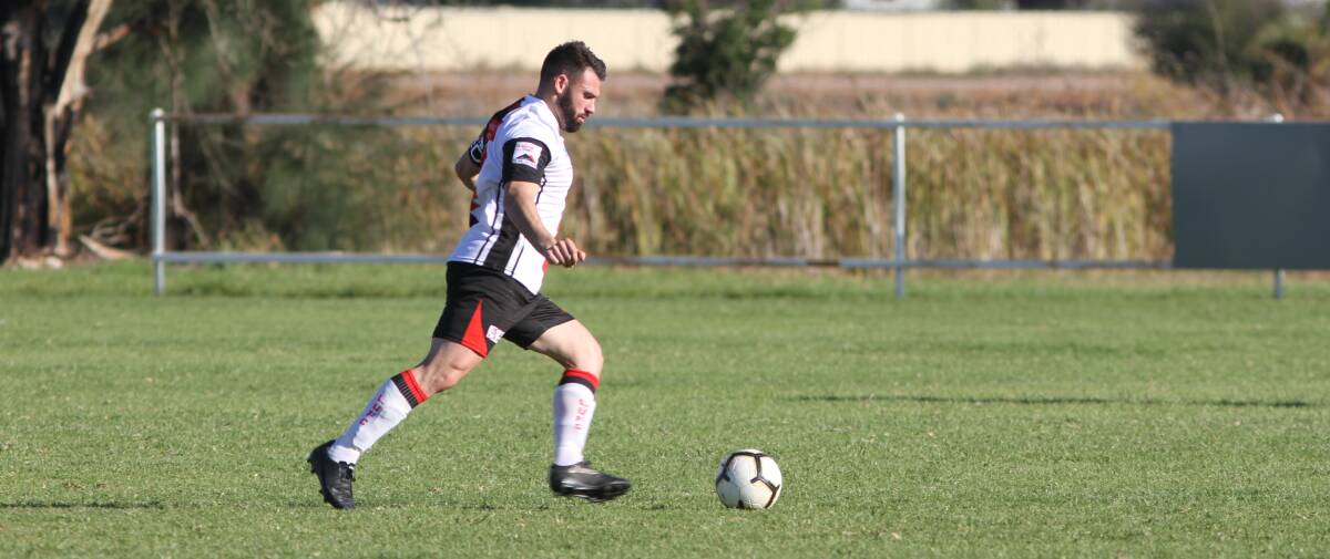 SEASON WILL GO AHEAD: Leeton United's Joey Fondacaro in action last year. The club will soon resume training with strict restrictions to be in place. 
