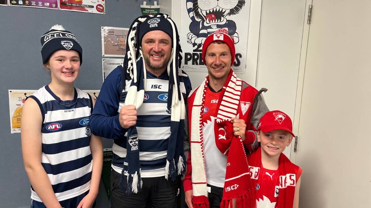 Cats fans Josie and Travis Irvin and Swans followers Jackson and Harrison Goman will be cheering their teams on during Saturday's grand final. Picture by Talia Pattison