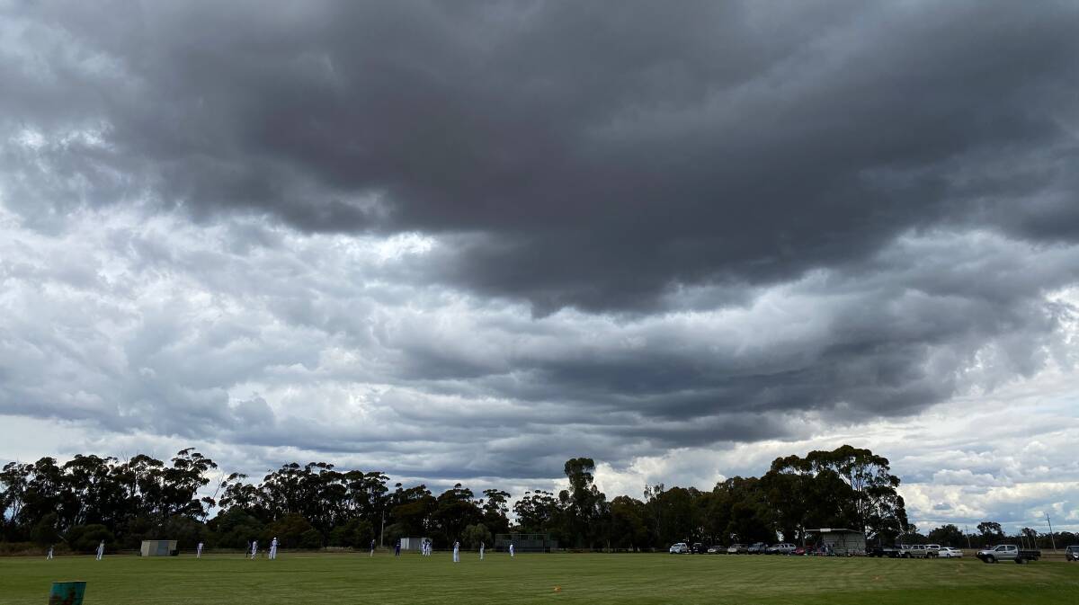 WOW: Storm clouds threaten overhead while a cricket match goes on nonetheless at Yanco Sportsground last weekend. Photo: Talia Pattison