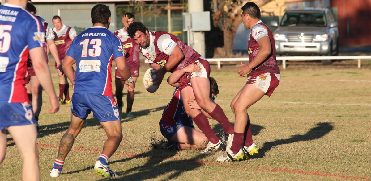 WATCH OUT: Yanco-Wamoon's Nick Puntoriero is taken down by the Darlington Point-Coleambally defence on Sunday afternoon. Photo: Anthony Stipo 