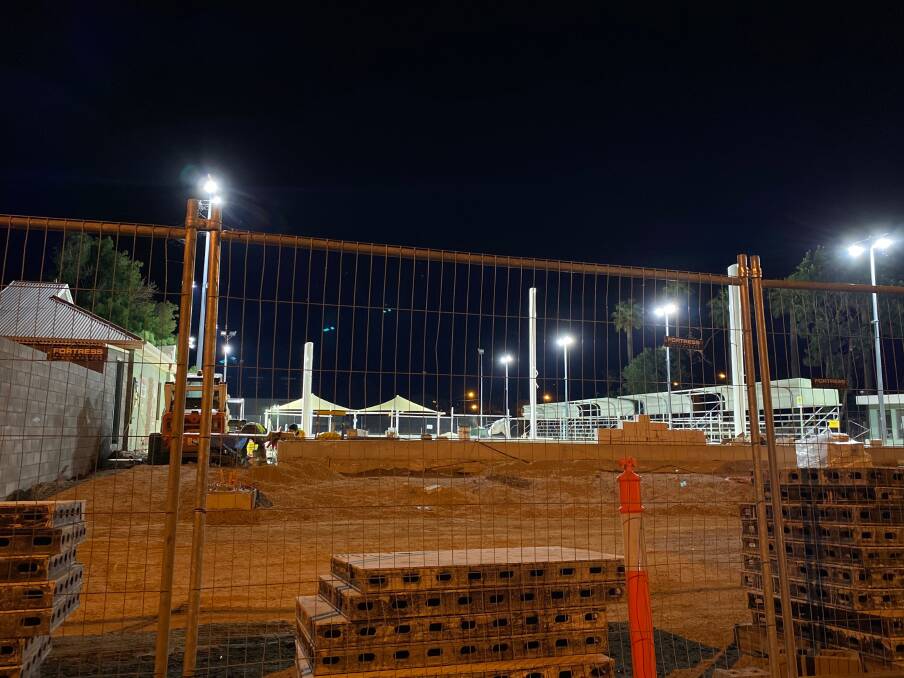 NIGHT SHIFT: Work on the redevelopment of the Leeton Regional Aquatic Centre is happening day and night. Photo: Talia Pattison