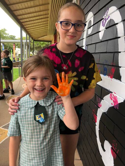 PLEDGE: Parkview Public School students say no to bullying while placing their hands on the mural. Photo: Talia Pattison 