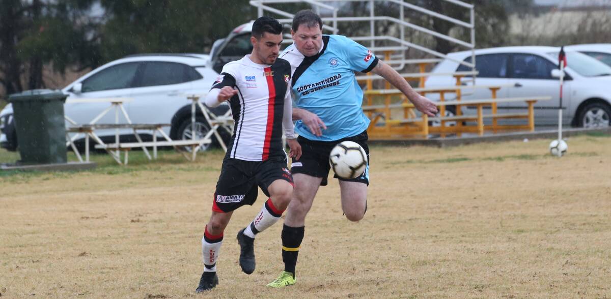 NO CONTEST: Leeton United's Nick Trifogli gets ahead of his Cootamundra opponent on Sunday afternoon. Photo: Anthony Stipo 