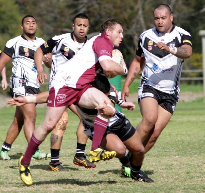 CHARGE: Yanco-Wamoon's Troy Preston surges forward during Sunday's victory over the Black and Whites. The game was the final one for the Hawks this season. 