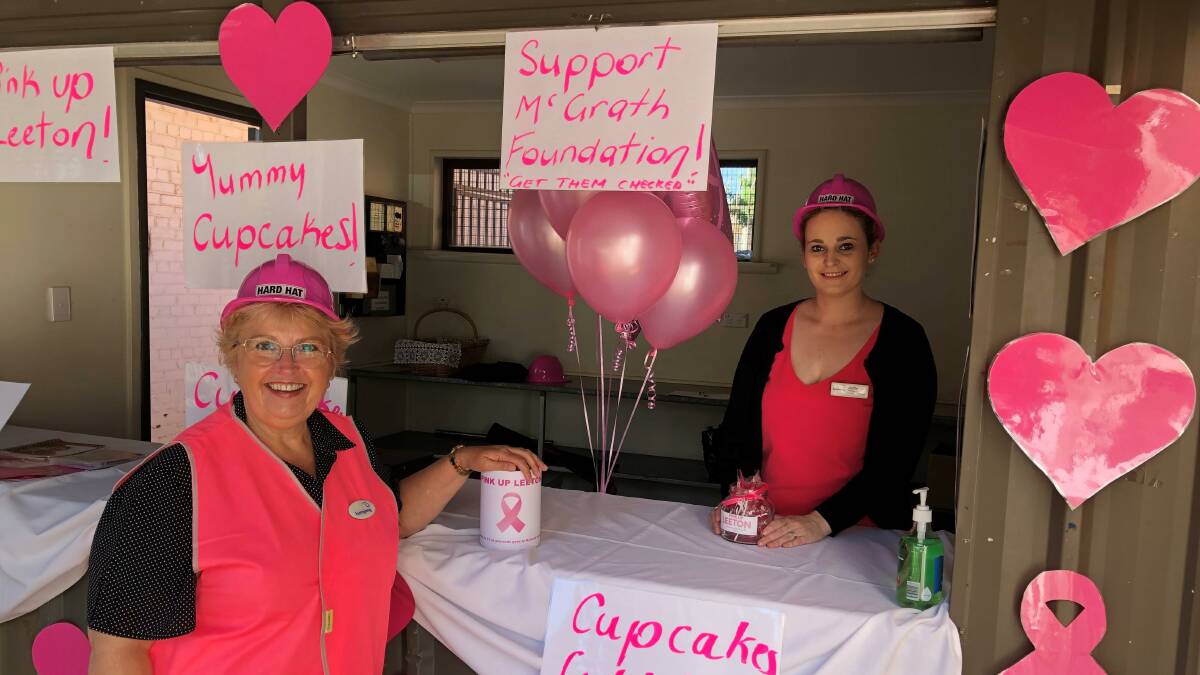 GREAT EFFORT: Donna Foley and Jodie Granger sell the delicious cupcakes. Photo: Contributed 
