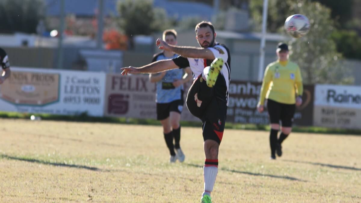 MOTION: Leeton United's Alex Dean attempts to get the ball moving during Sunday's clash with Cootamundra. Photo: Talia Pattison