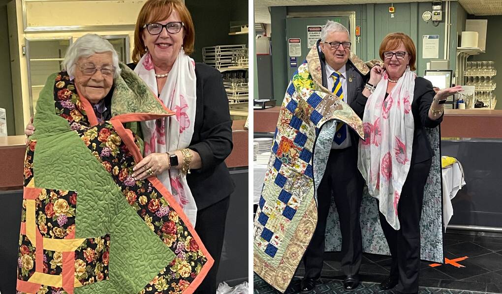WELL DESERVED: Leeton RSL Sub-branch life members Heather Whittaker (left) and John Power accept their specially-made quilts from Pauline James. Photos: Supplied