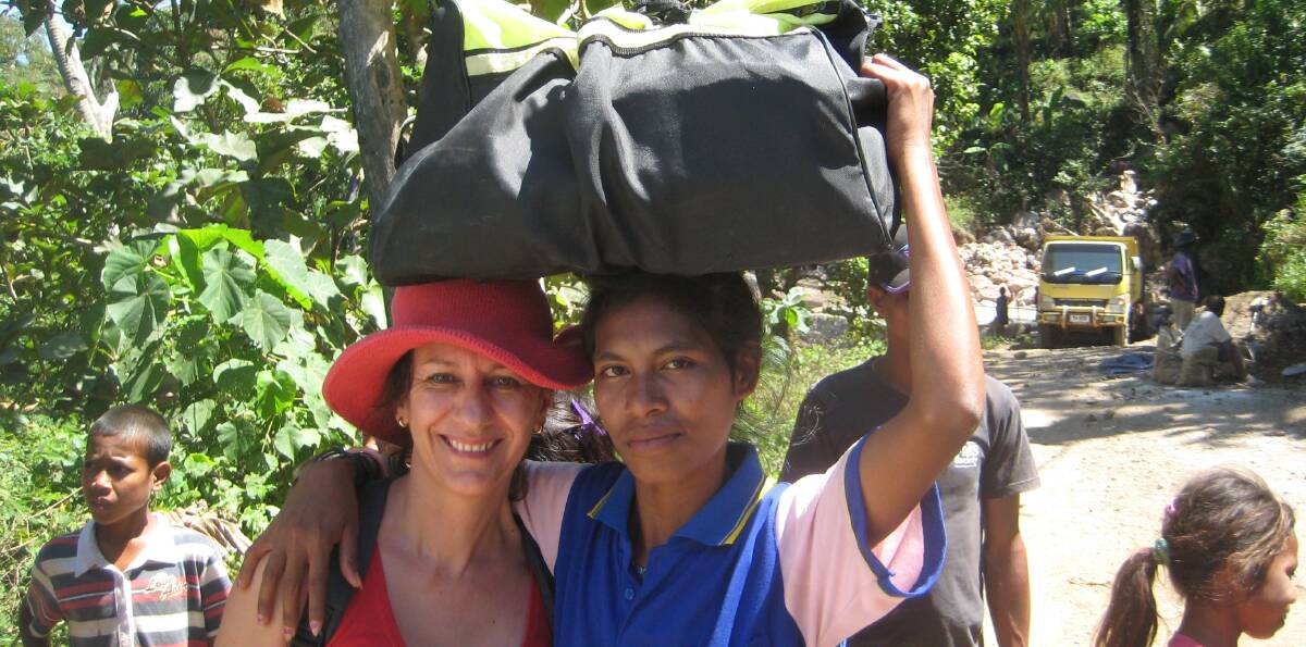 IMMERSE:  Liz Wrigley (left) from the organisation Each is one of many that has visited Luro has part of a homestay program. 
 
