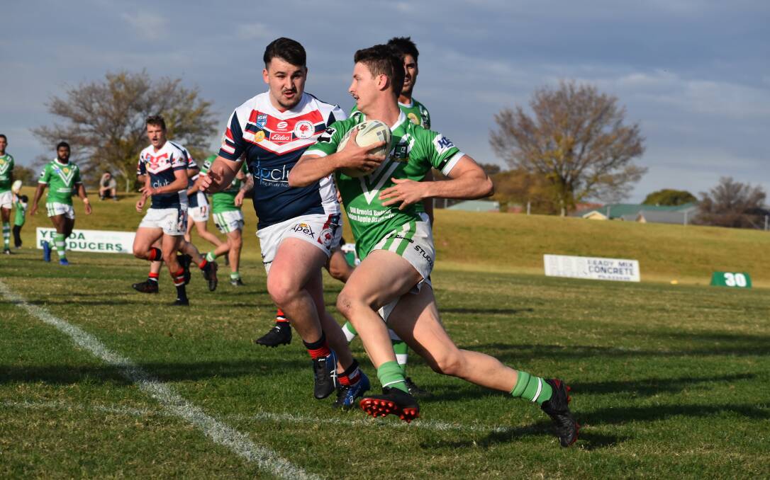 EVADE: Leeton's Kirtis Fisher outmaneuvers the Darlington Point-Coleambally defence in their recent match up. The Greens are on the road this weekend to take on TLU. Photo: Liam Warren