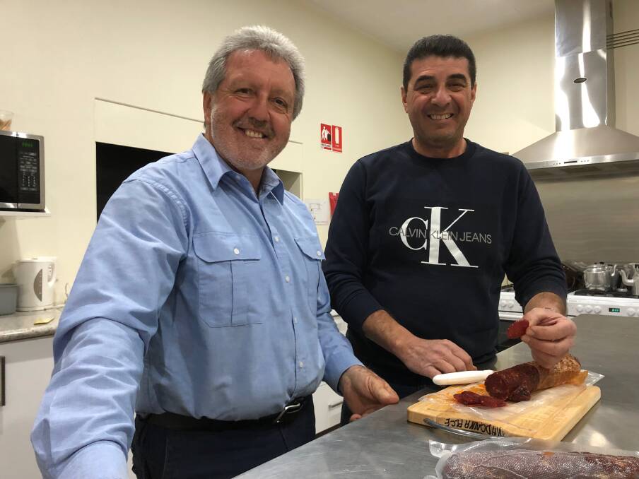 YUMMY: George Nardi (left) and Dom Amato from the Leeton Italian Catholic Committee are busily preparing for this weekend's event. Photo: Talia Pattison