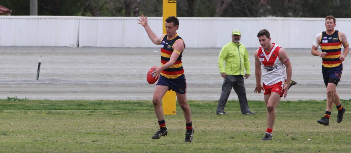 TWO TO GO: Leeton-Whitton's Tom Meline kicks the ball in from the backline during his side's last outing at Leeton Showground a fortnight ago. Photo: Liam Warren 