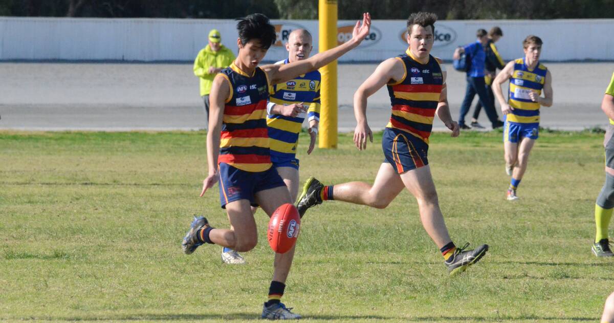 LAST OUTING: Leeton-Whitton's Jay Tang boots the ball away for the Crows during an earlier match this season. The Crows will play their final game of 2019 on Saturday. 