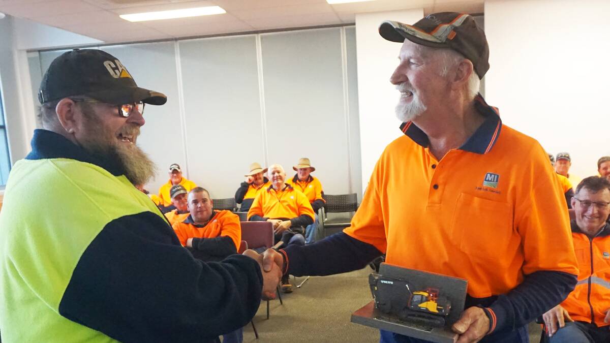 Heavy plant program leader Nev Gras congratulates Terry Sivewright on his retirement. Photo: Contributed 