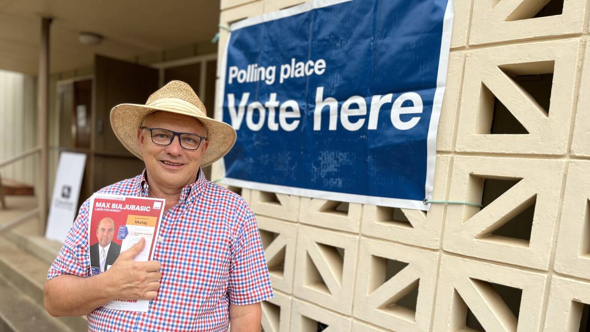 Labor Party member and Leeton resident Michael Kidd hands out how-to-vote flyers outside Madonna Place on election day. Picture by Talia Pattison