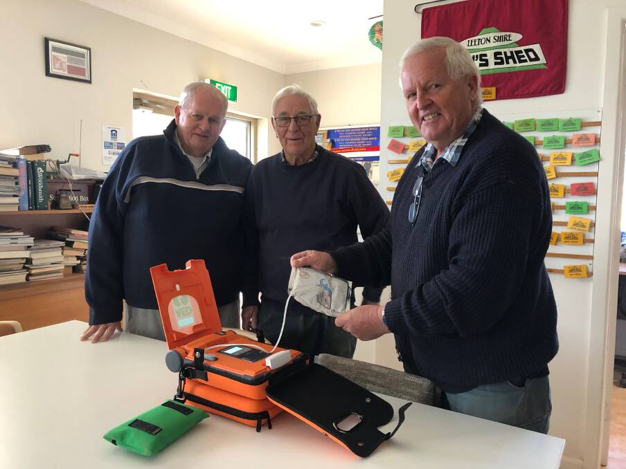 VITAL: Leeton Men's Shed members Ian Errey, Tom Knagge and Ron Hutton with the new defibrilator. Photo: Talia Pattison