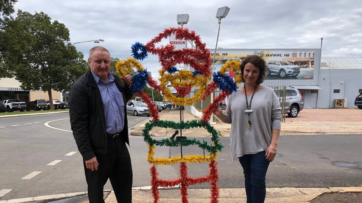REVAMP: Light Up Leeton chairman Carl King and Leeton's Shire Council's Suesann Vos with the old Christmas decorations. Photo: Talia Pattison