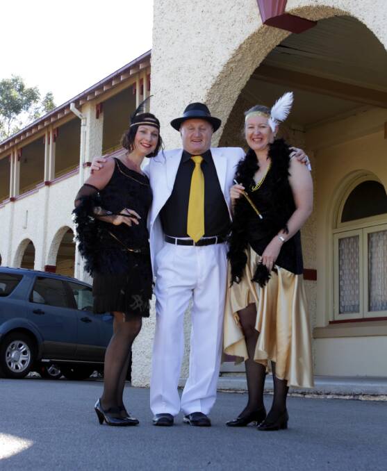 READY TO RUMBLE: Leeton SunRice Festival committee members Sally Doig, Carl King and Chris Thompson can't wait for tonight's 1920s-themed opening event. 
