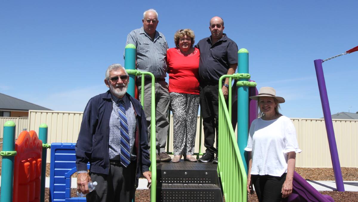 The Helson family - Barry, Melly and Paul Helson - with mayor Paul Maytom and Member for Farrer Sussan Ley at the new park. Photo: Talia Pattison