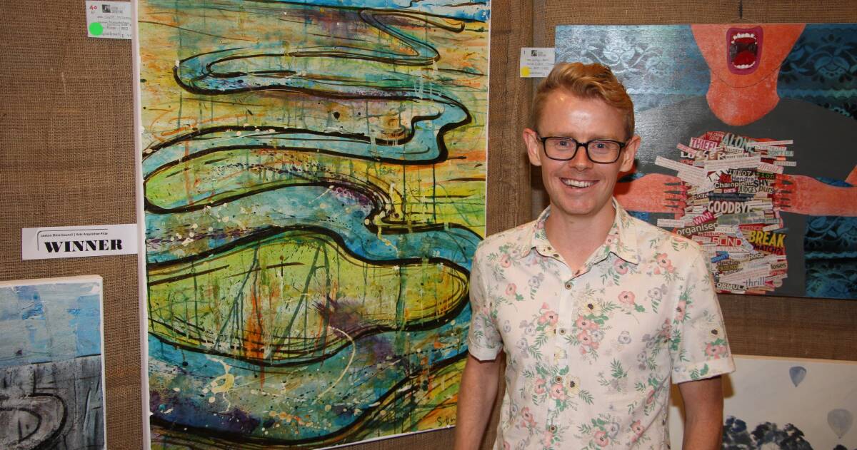 CLEVER: Artist Scott McGrevy poses in front of his piece "Murrumbidgee Ash Sunshine and Rain", which was the winner of the overall acquisitive prize.