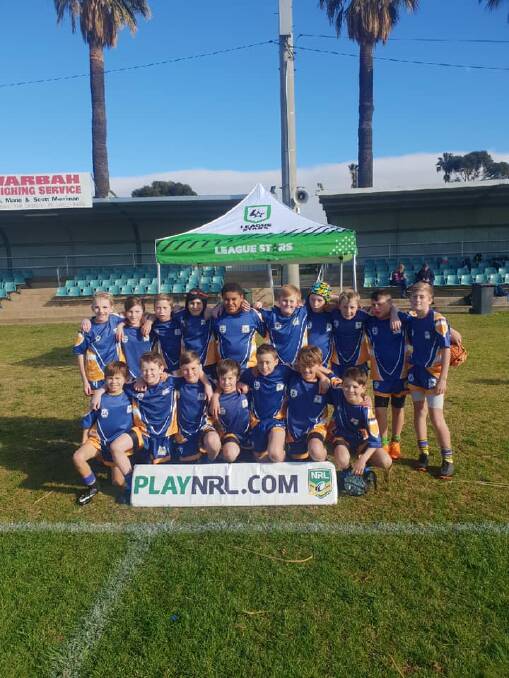 GROUP EFFORT: Leeton Public School's newest rugby league champions celebrate their victory as a team. Photo: Contributed 