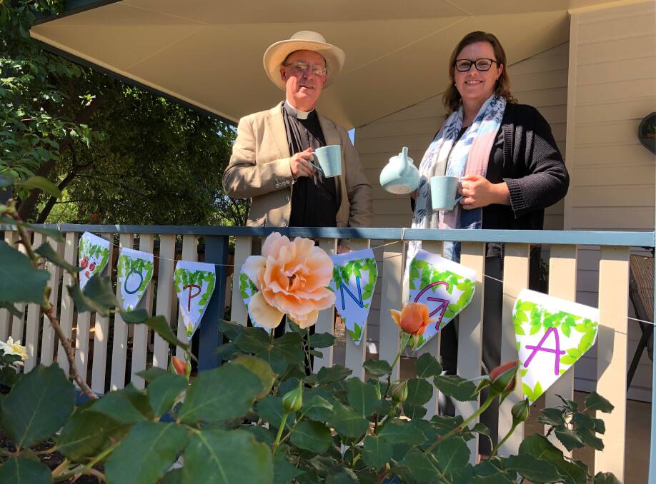 ALL SET: Father Robert Murphy and Mandy Walsh, who will show off her garden, during the upcoming event. Photo: Talia Pattison