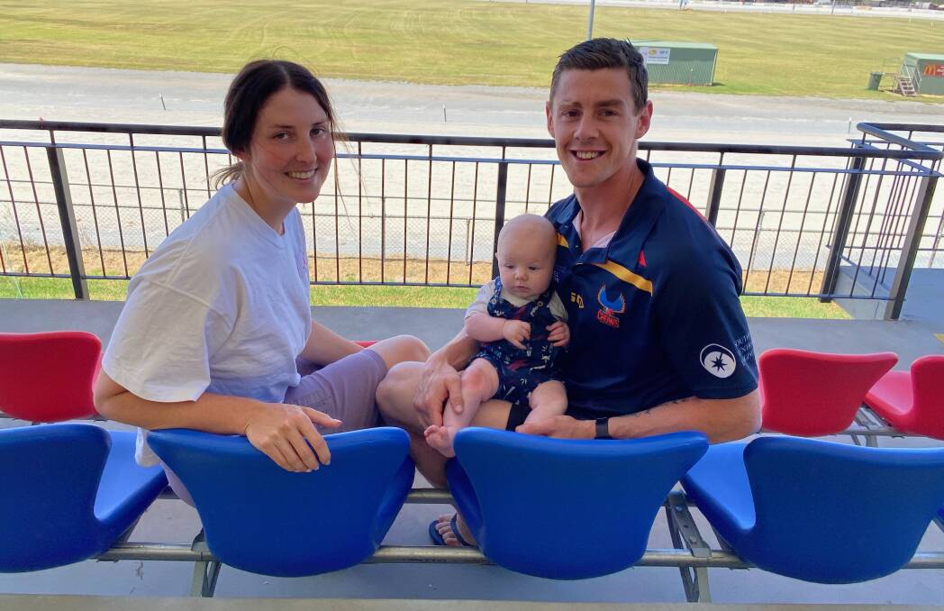 ALL SYSTEMS GO: Leeton-Whitton coach Sam Darley with partner Lilly Hine and son Clay, three months, at the Leeton Showground. Photo: Talia Pattison 