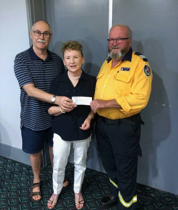 GENEROUS: Eric Taylor and Rhonda Thomas hand the funds over to Yanco-Wamoon RFS brigade captain Pat O'Callaghan. 