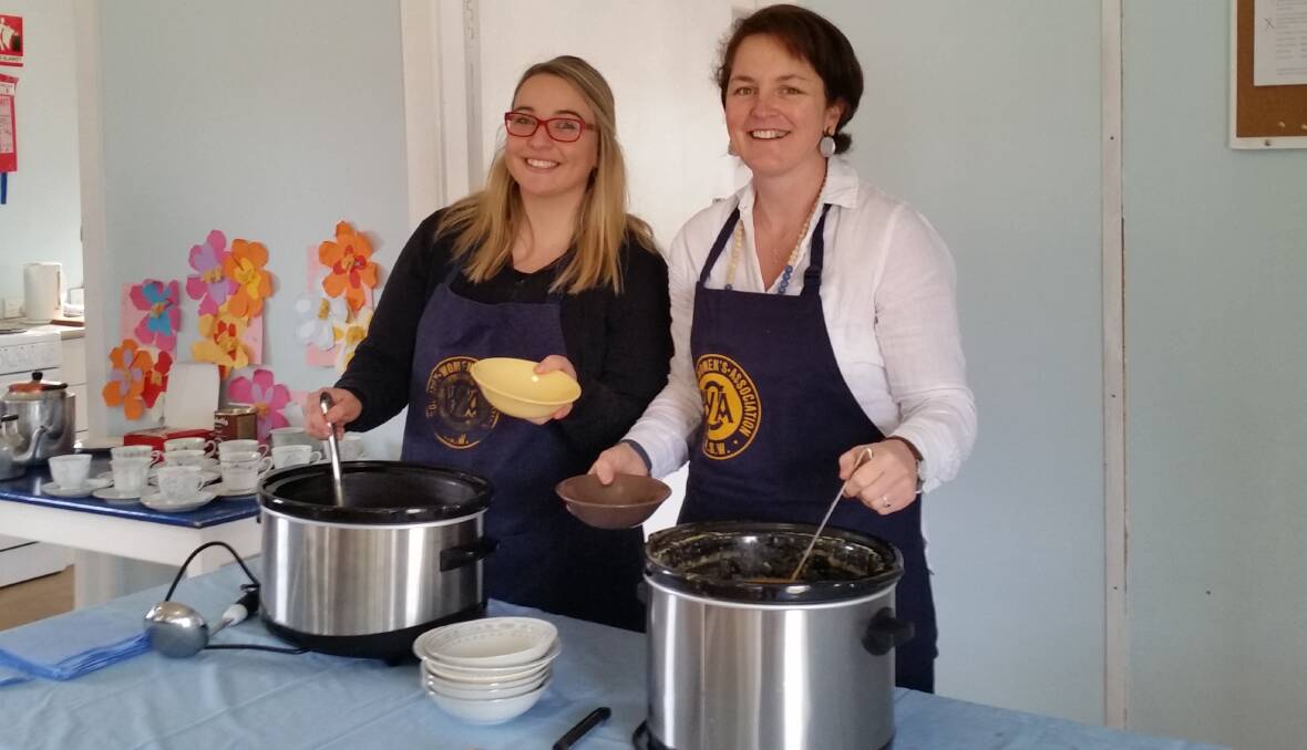 DELISH: Tessa Hamilton and Katrina Ovenden serve up the delicious feast as part of the Yanco CWA's annual winter soup luncheon. 