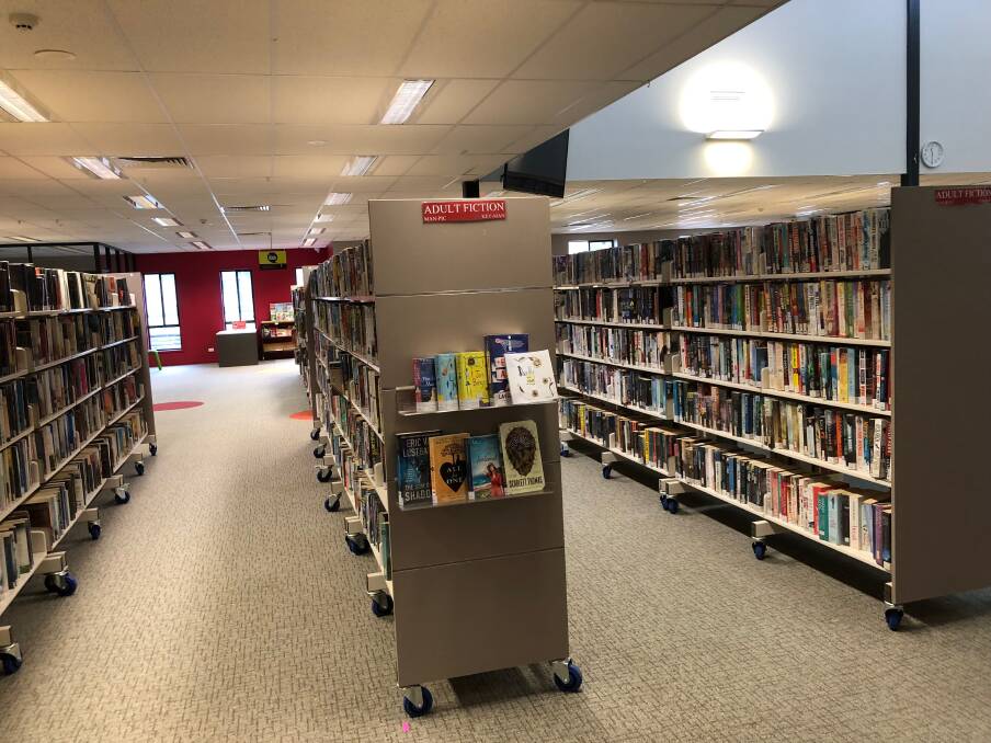 EMPTY: Staff are the only ones walking the aisles of the library after its doors had to be closed as part of coronavirus restrictions. Photo: Talia Pattison 