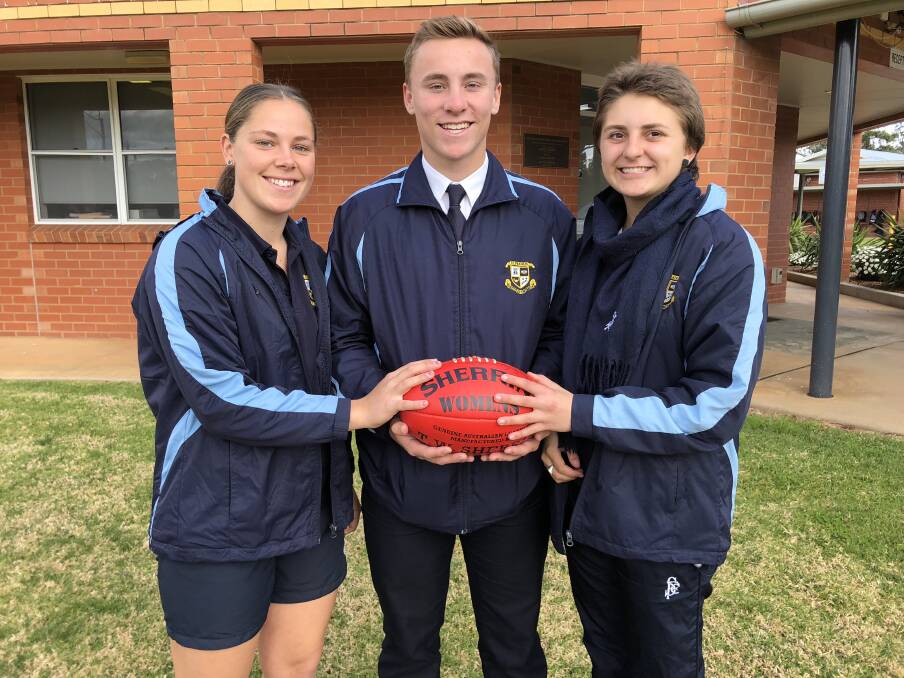 EXCELLING: St Francis College students Makayla Jones, Coopa Steele and Abby Favell have kicked it up a notch on the Aussie Rules field this year. Photo: Talia Pattison