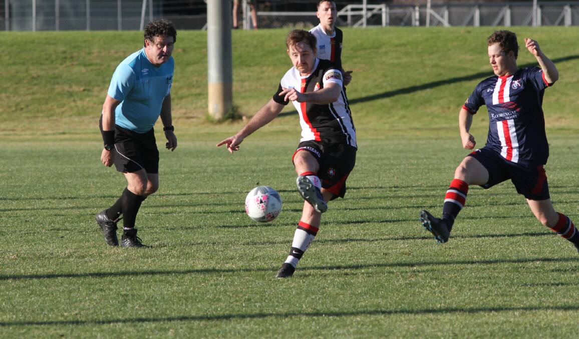 MOVE ON: Leeton United's Conor Edenden gets the ball away during last week's match against Henwood Park. Photo: Talia Pattison