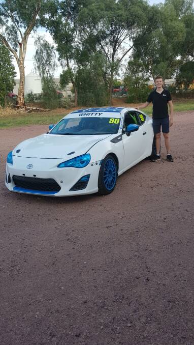 REBUILD: Leeton's Jarrod Whitty with his vehicle which required plenty of work in the off-season following an incident in the last race of 2019. Photo: Contributed