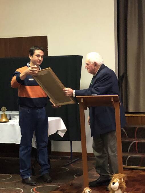 WELCOME: Yanco Lions member Ron DeMartin (right) on behalf of the late Buster Ryan handing over the Charter to incoming President Travis Bambrick. Photo: Supplied