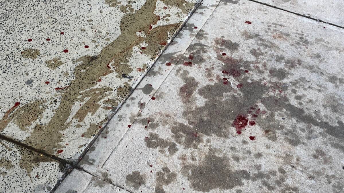 Blood was seen on the footpath as a result of the attack. 