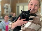 Kasey Aliendi with Misha the cat. Kasey recently won the Certificate IV in Vet Nursing Outstanding Student award at a special TAFE ceremony. Picture supplied 