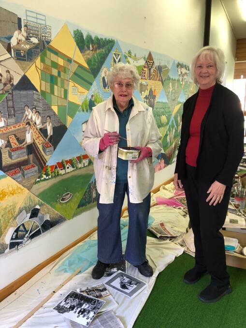 TALENTED: Lee Blacker-Noble with Leonie Napier from the Yanco Agricultural Institute as the mural nears completion. Photo: Talia Pattison 