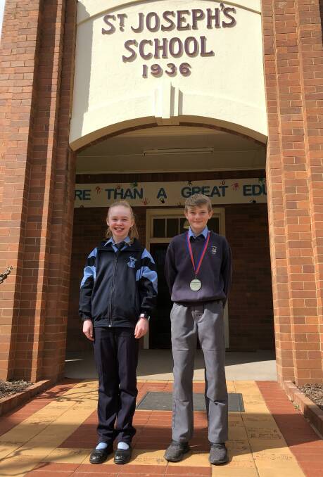 WELL DONE: St Joseph's Primary School students Chelsea Purtill and Calan Nicholls have been excelling on the athletics track. Photo: Talia Pattison