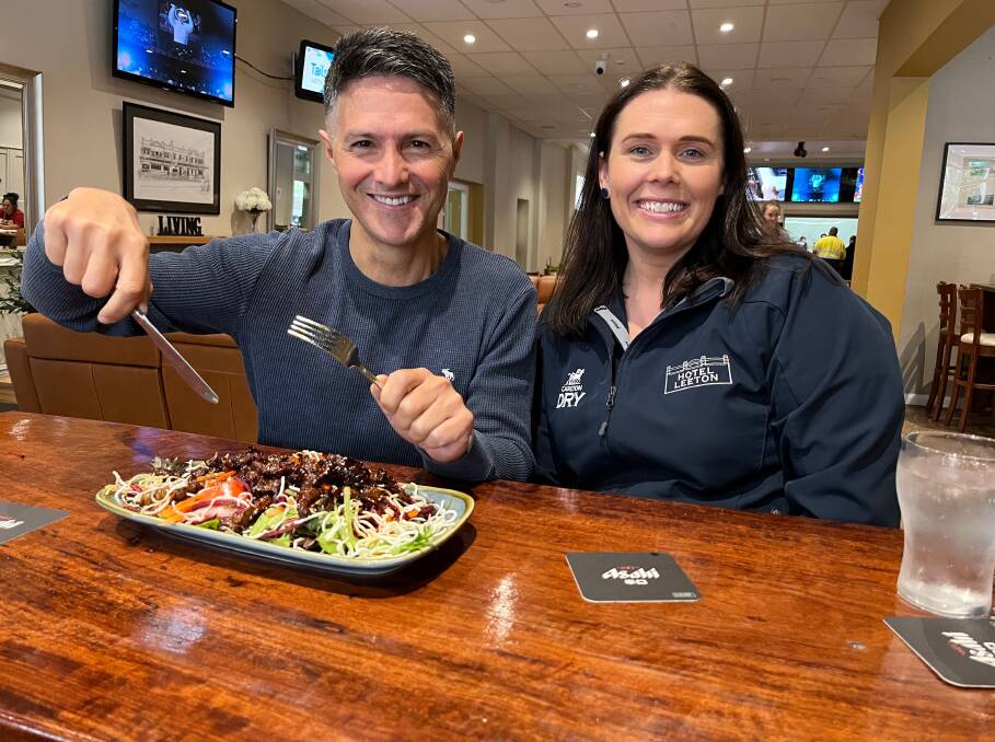TUCK IN: NSW Minister for Customer Service Victor Dominello with Hotel Leeton's Hannah Middleton last week. Photo: Talia Pattison