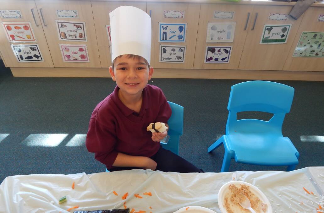 DELICIOUS: Wamoon Public School year 1 student Braxton Johnson shows off his sushi creation.