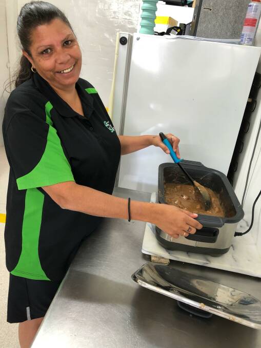 COOKING UP A STORM: Kitchen supervisor Bev Moore whips up the lunch special on Wednesday at the Leeton Community Op Shop. Photo: Talia Pattison 