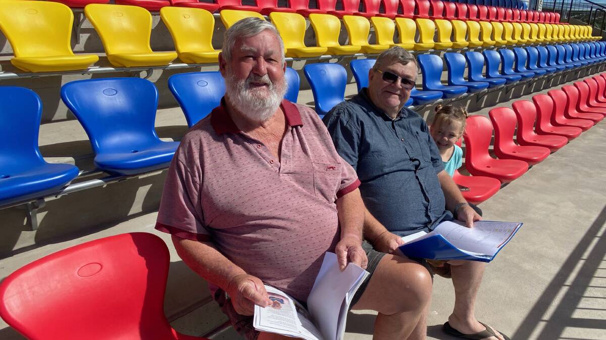 PLAN: Peter Slattery (left) with Tom Thompson and Darcy Thompson, 3, are in the process of organising the 1971 Leeton Redlegs premiership reunion. Photo: Talia Pattison