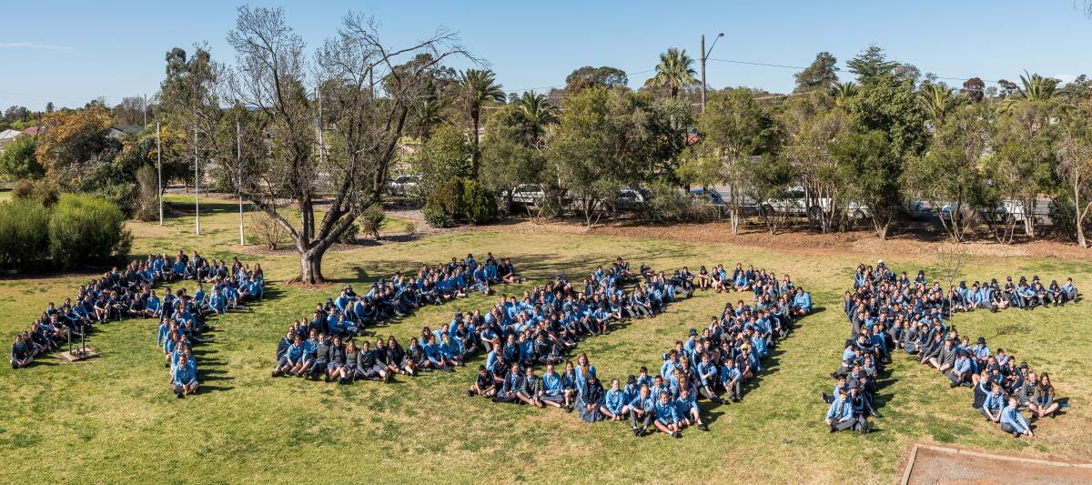 IMPORTANT: St Francis College students spell out a vital question during R U Ok? Day activities at the school. 