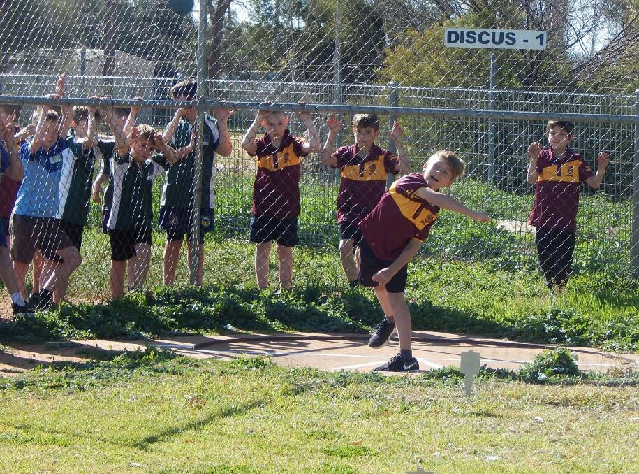 EFFORT: Students watch on during the discuss component of the recent Small Schools Athletics carnival. Photo: Contributed 