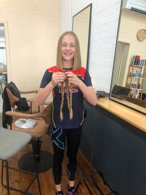 Leeton's Sage Deaton had more than 40 centimetres of her hair cut off all in the name of charity. Picture supplied