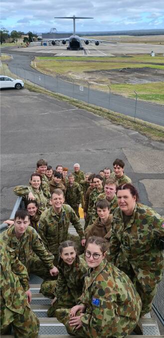 VERY COOL: Leeton Army Cadets and Captain Tracey Bullivant with the C17 Globemaster military transport plane in the background at Nowra recently. Photo: Supplied