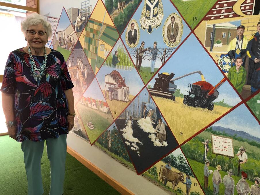 HISTORY MADE: Leeton artist Lee Blacker-Noble with her completed mural masterpiece at its opening on Thursday. Photo: Talia Pattison